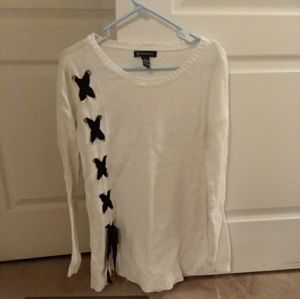 Long, white sweater with ribboned accent